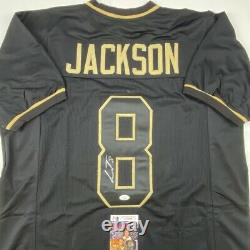 Autographed/Signed LAMAR JACKSON Baltimore Blackout Football Jersey JSA COA