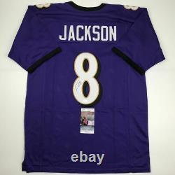 Autographed/Signed LAMAR JACKSON Baltimore Purple Football Jersey JSA COA Auto