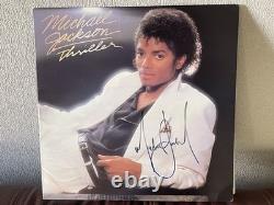 MICHAEL JACKSON AUTOGRAPHED SIGNED THRILLER LP AND LARGE SHEET withBECKETT LOA